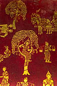 Luang Prabang, Laos - Wat Pa Phai the 'Bamboo Forest Monastery'. Inside gilded stencils against a red lacquered background depict scenes from the Buddhist hell. 